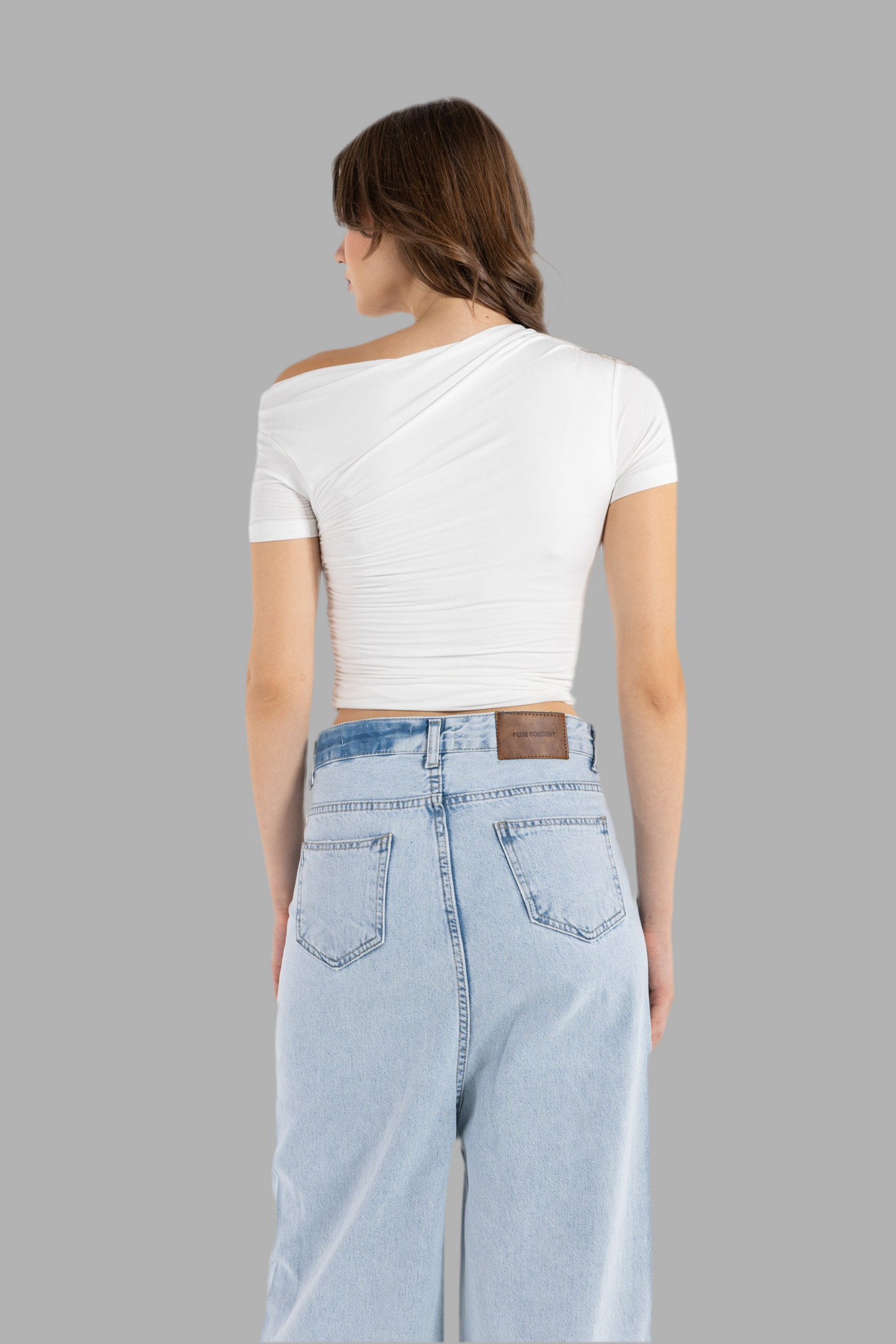 DRAPED ASYMMETRIC TOP IN WHITE