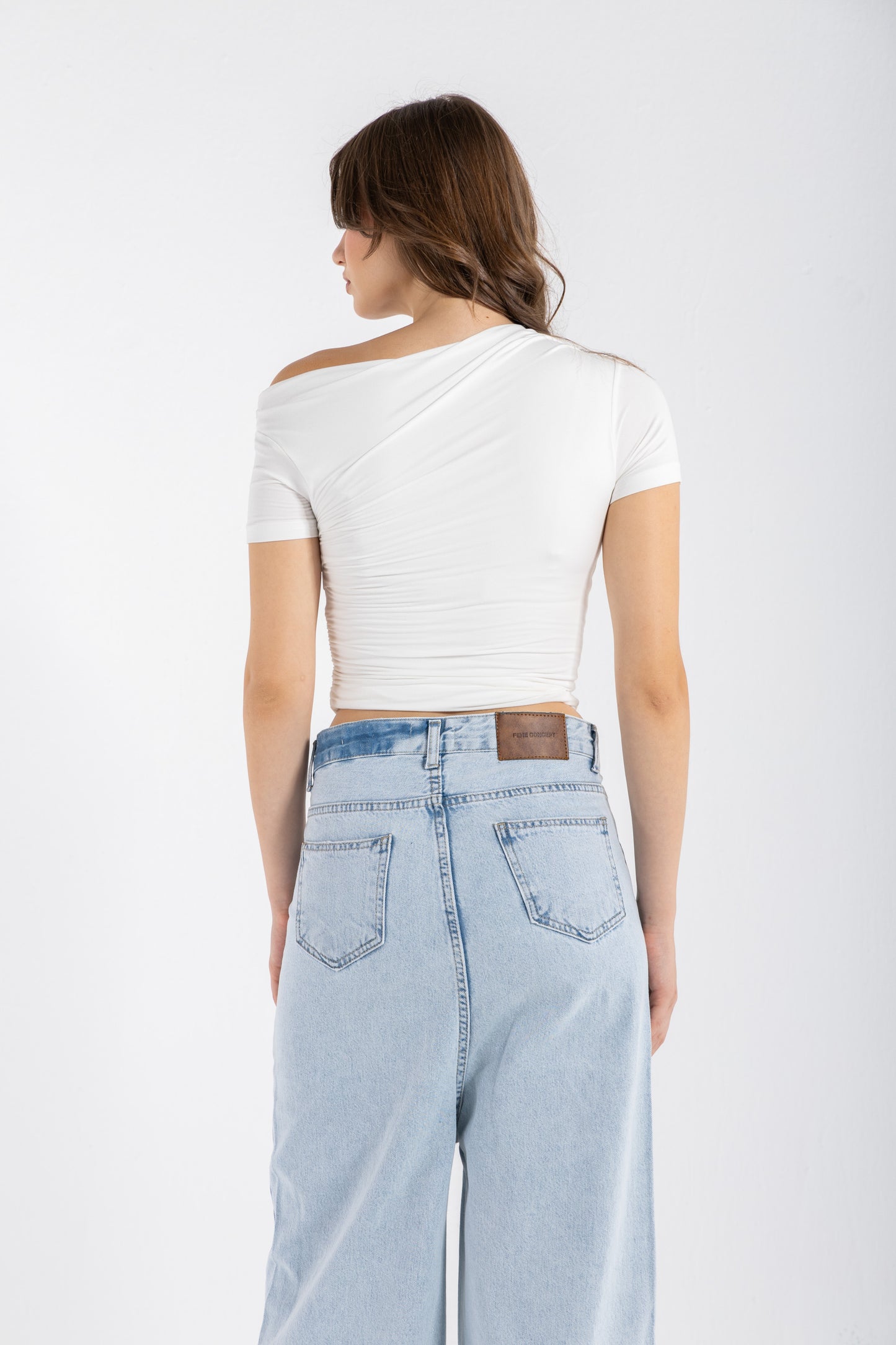 DRAPED ASYMMETRIC TOP IN WHITE