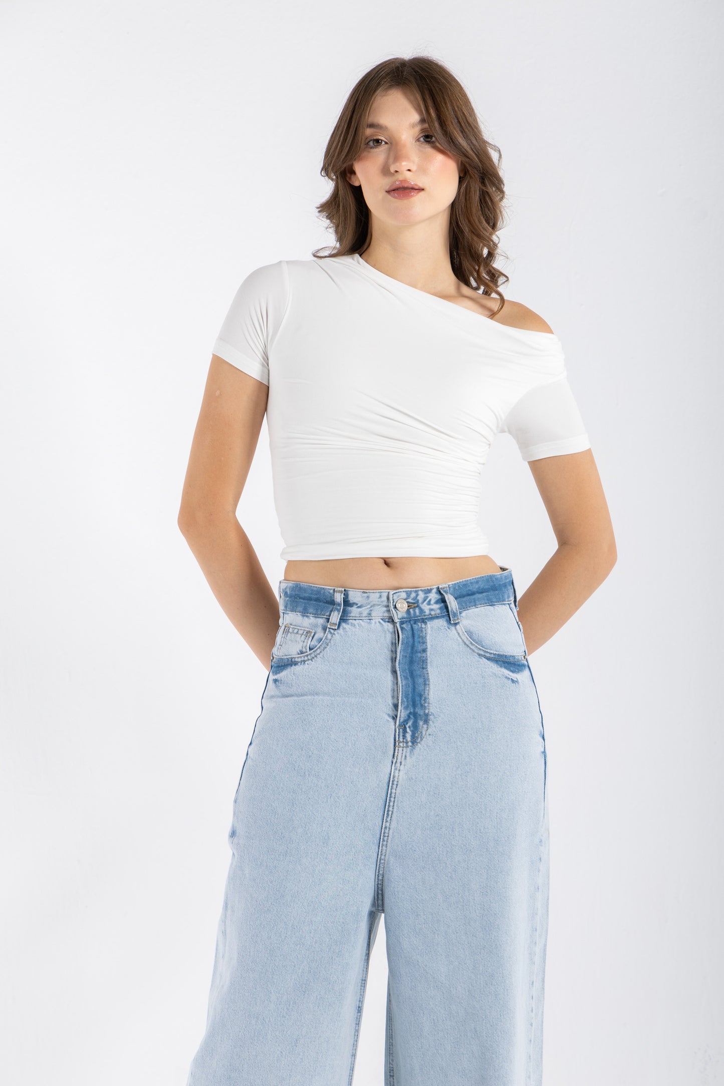 DRAPED ASYMMETRIC TOP IN WHITE