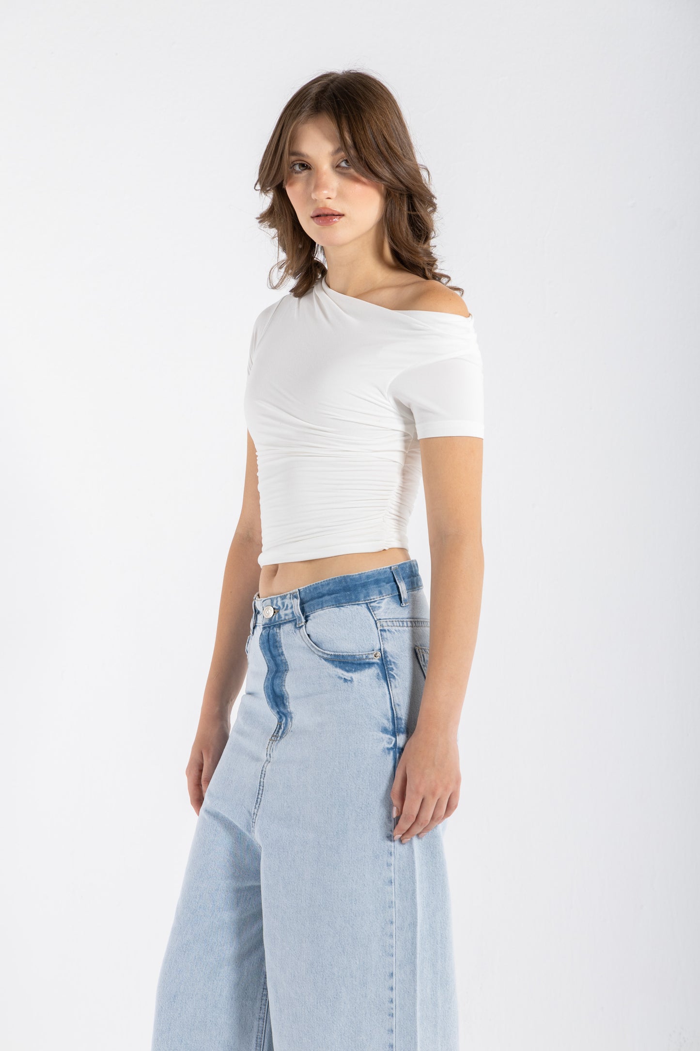 DRAPED ASYMMETRIC TOP IN WHITE