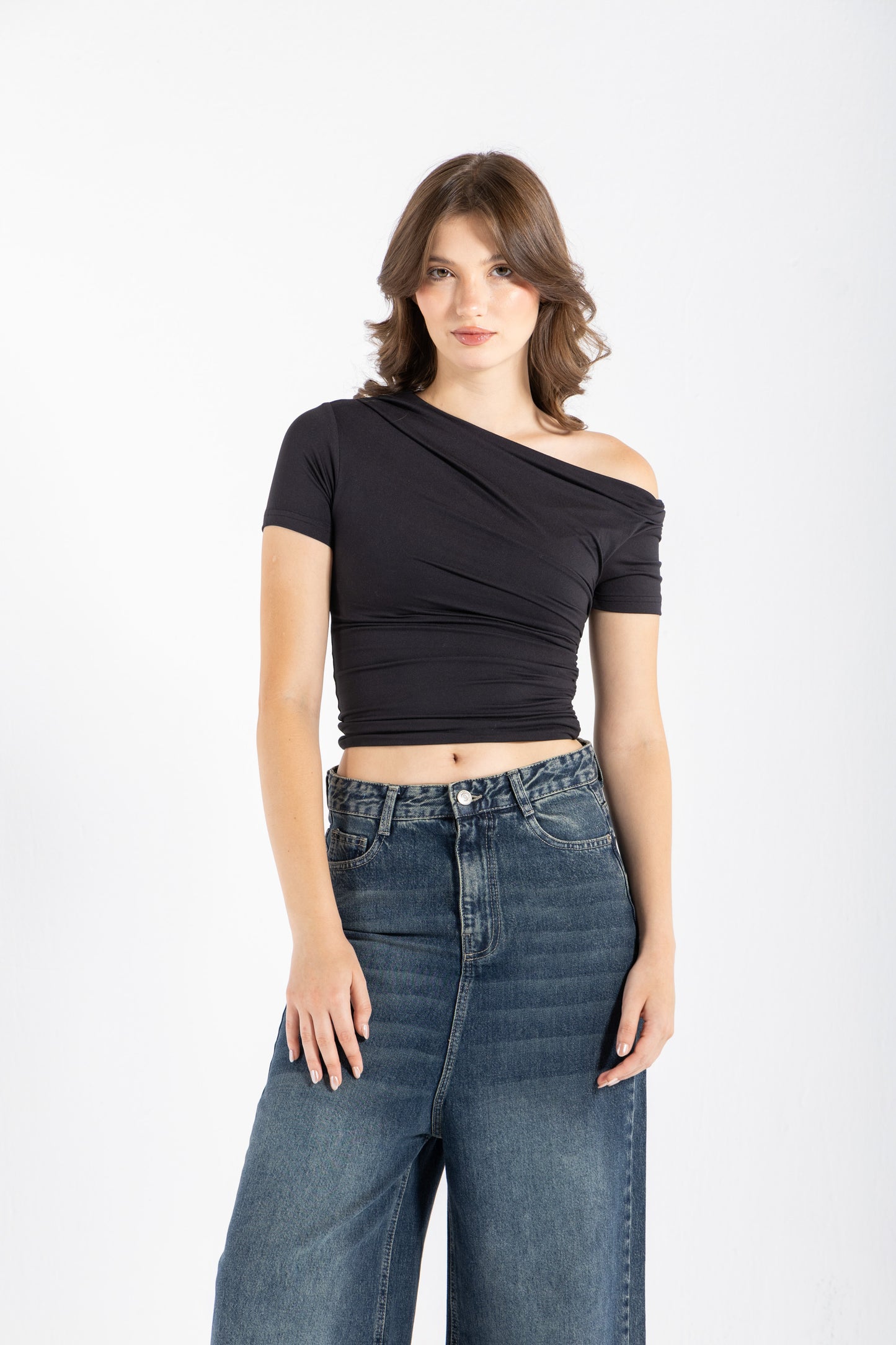 DRAPED ASYMMETRIC TOP IN BLACK