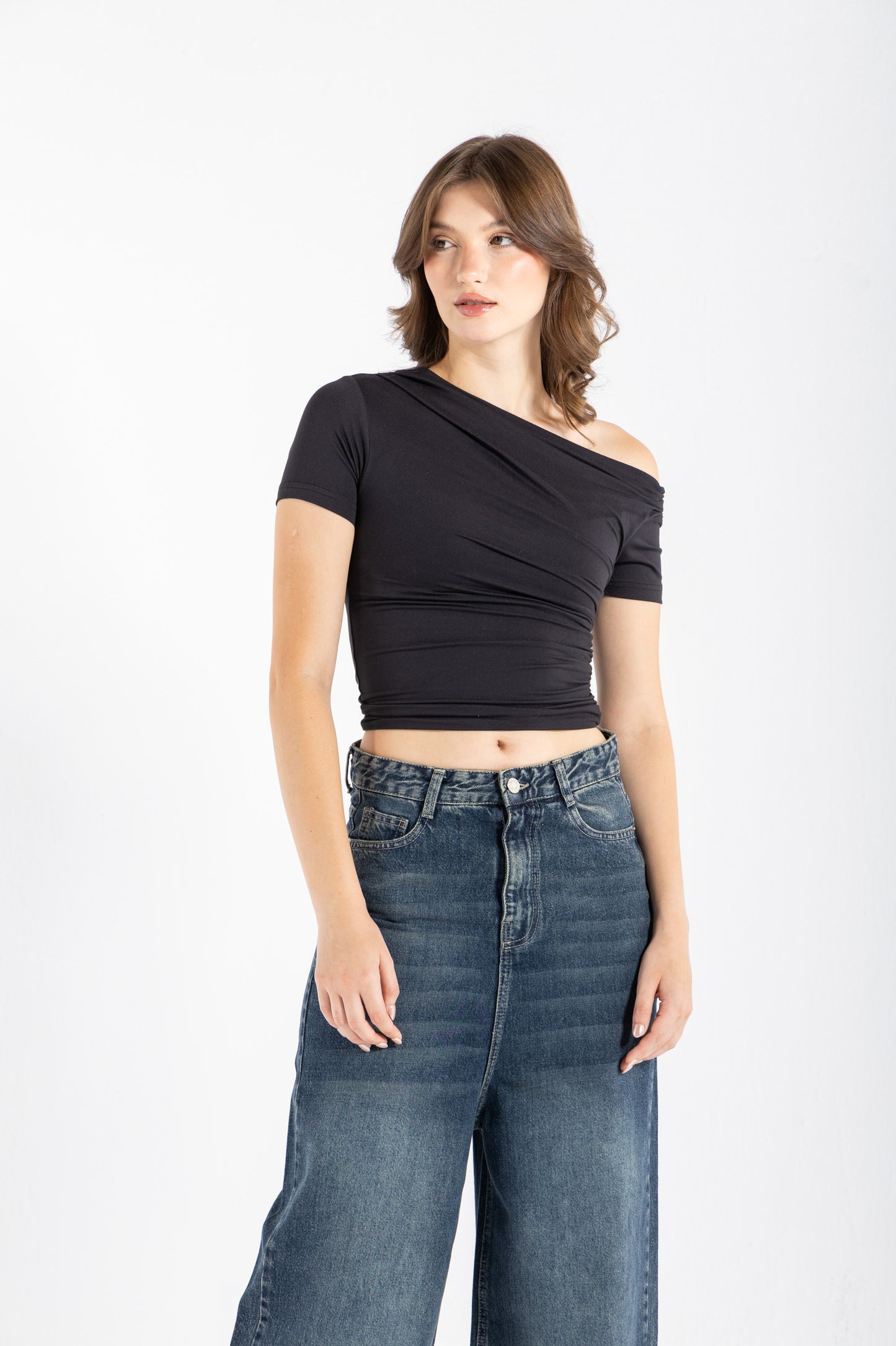 DRAPED ASYMMETRIC TOP IN BLACK